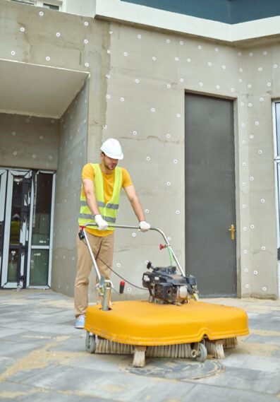 man-operating-special-equipment-cleaning-construction-site_cropped